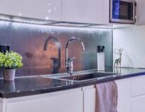 indoor, sink, cabinet, wall, plumbing fixture, countertop, tap, home appliance, mirror, bathtub